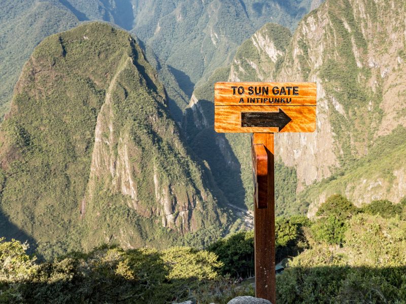 Sign pointing the way to the Sun Gate or Intipunku