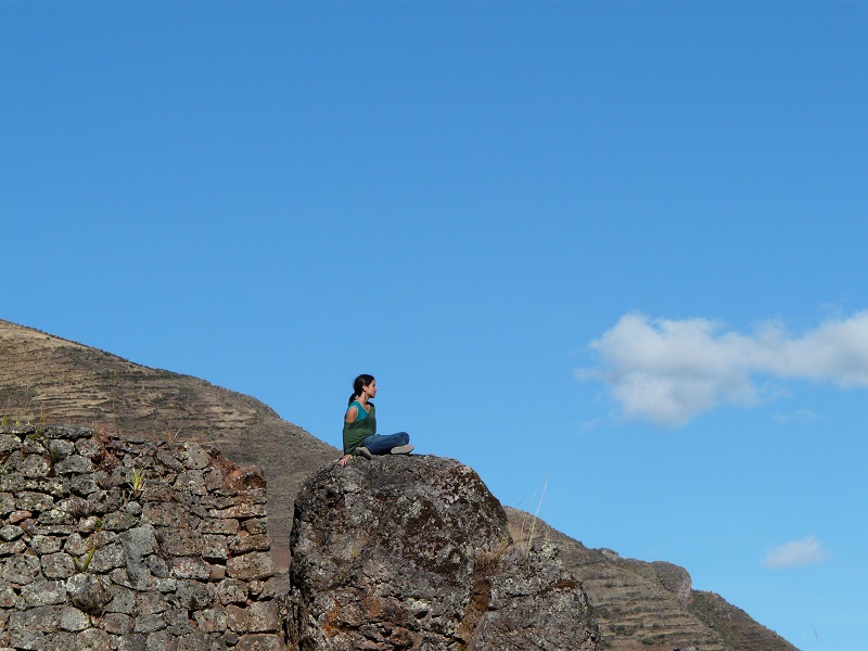 Me sitting on a rock, at the ruins