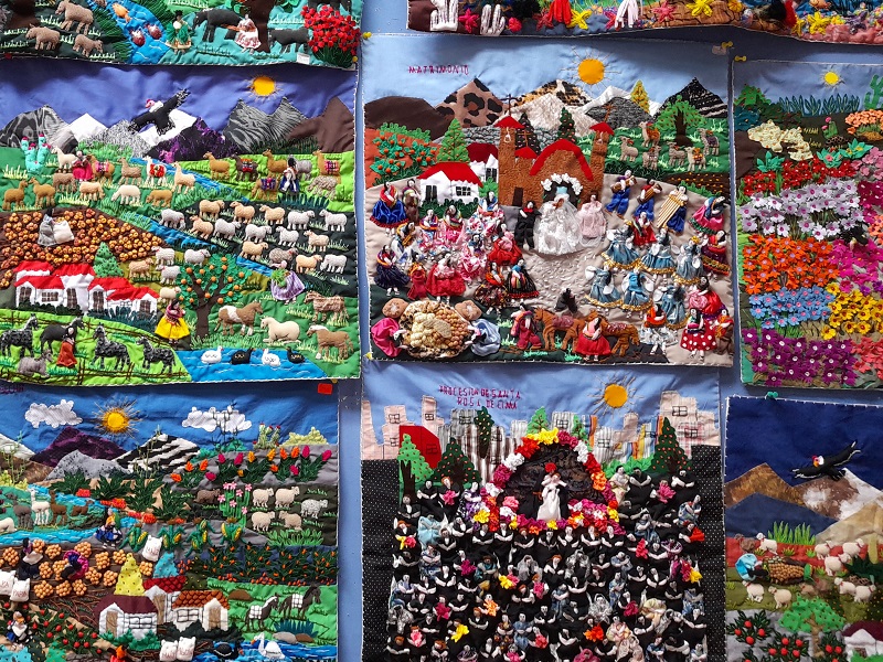 Arpilleras (fabrics) showing landscapes and festivities from Peru