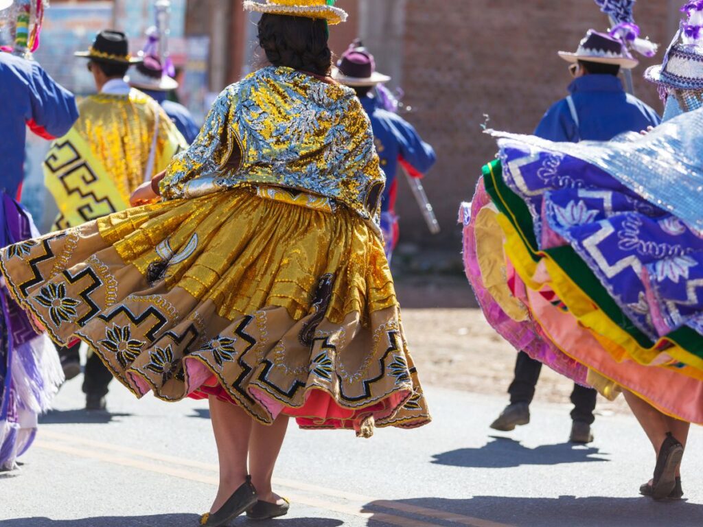 Women wearing typical clothes at a traditional festival in Peru