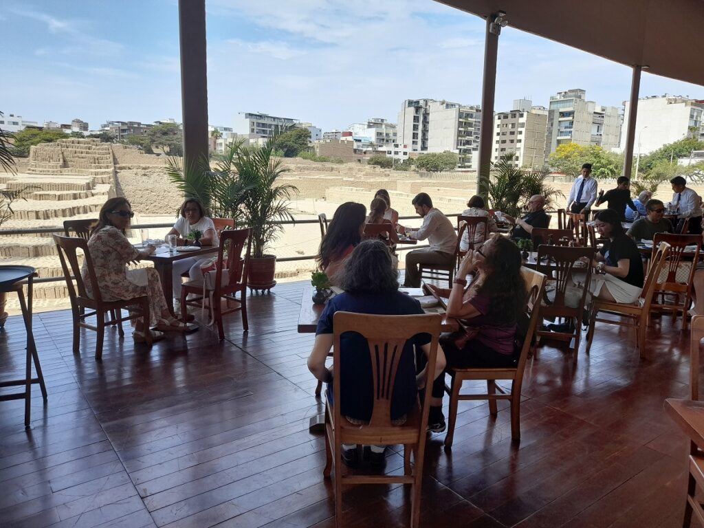 La Huaca restaurant. People having lunch overlooking the ruins.